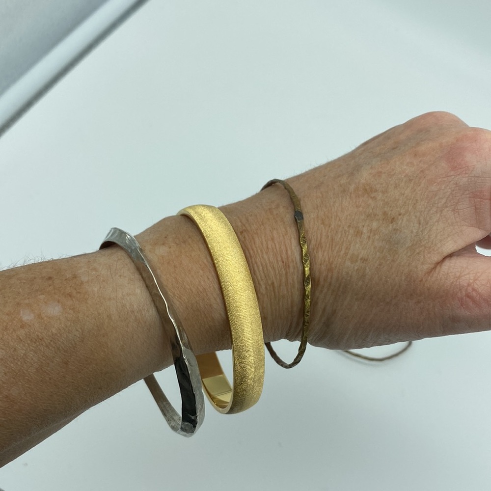 Stack of 4 bangle bracelets, gold, silver, copper